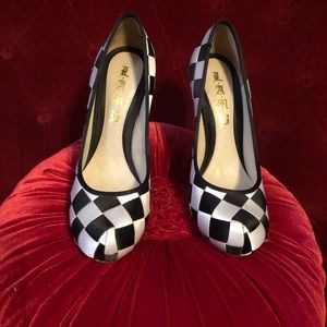 LAMB size 7.5 like new black and white checkered heels.